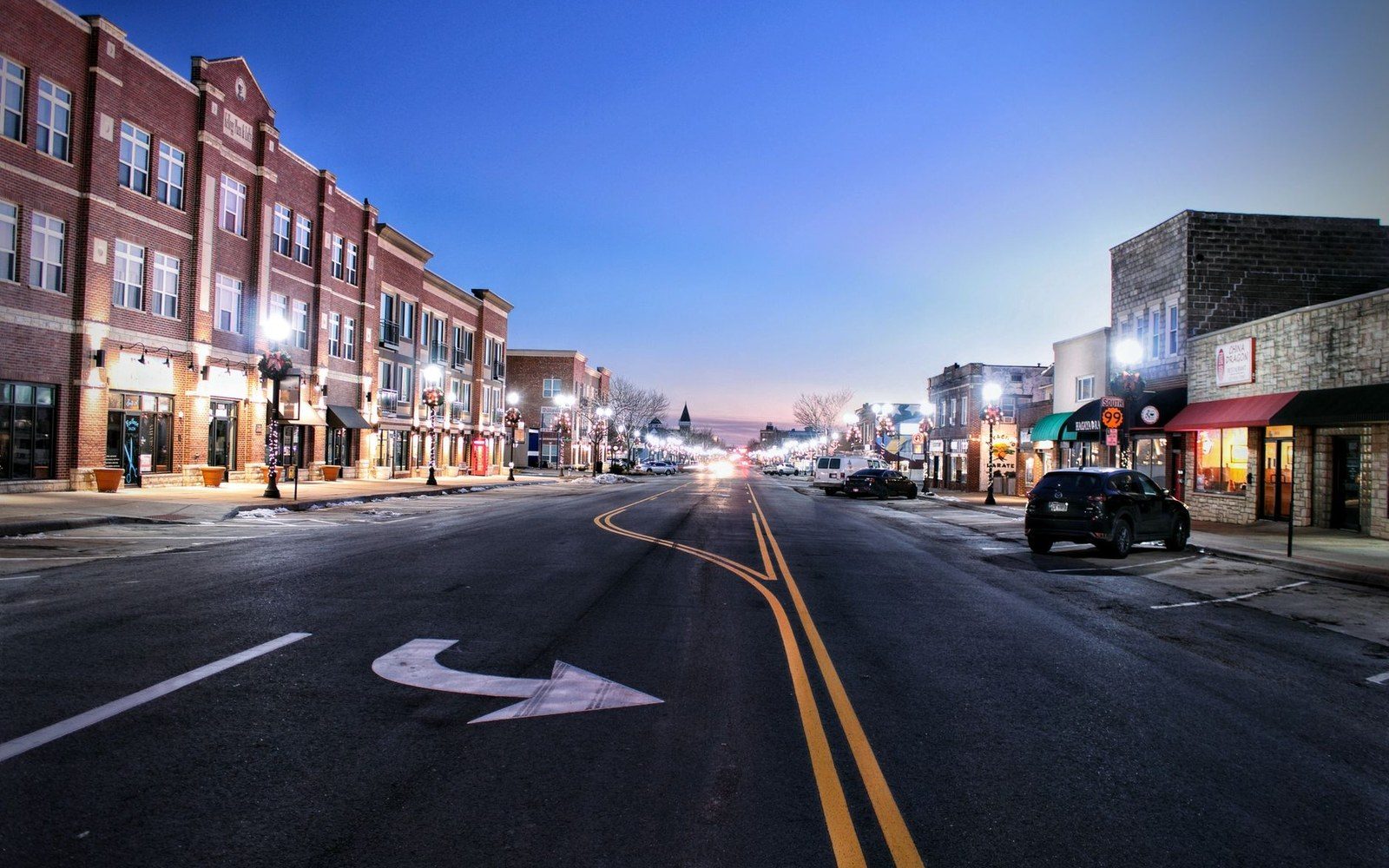 a small-town main street, low buildings, wide street